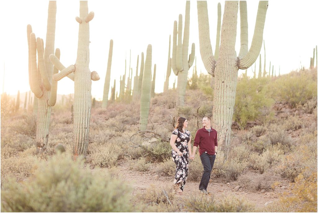 Tucson Engagement Photos Tucson Photographer Ryan and Cassidy walking by cacti