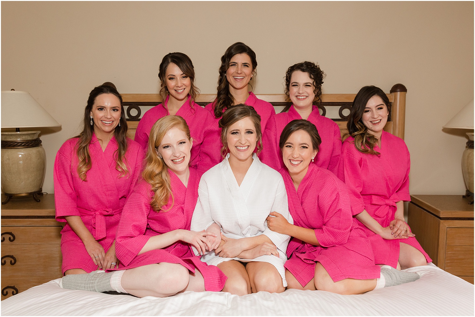 Highlands at Dove Mountain Wedding Grace + Danny bride and bridesmaids in hot pink silk getting ready robes