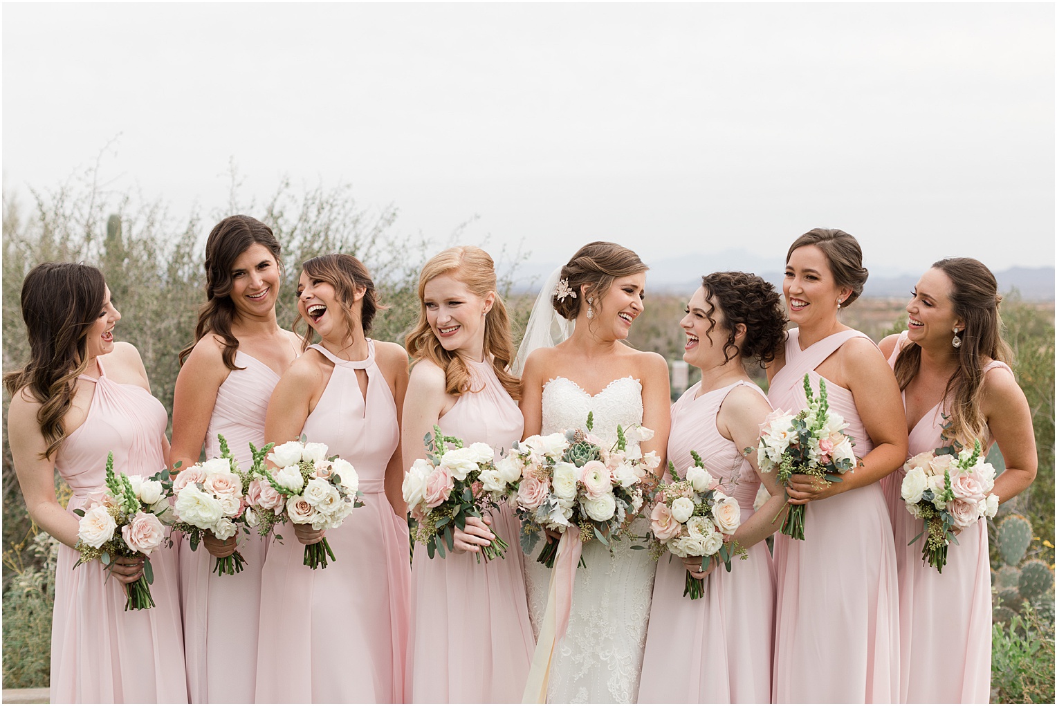 Highlands at Dove Mountain Wedding Grace + Danny bridesmaids with romantic blush and ivory bouquets and floor length blush dresses