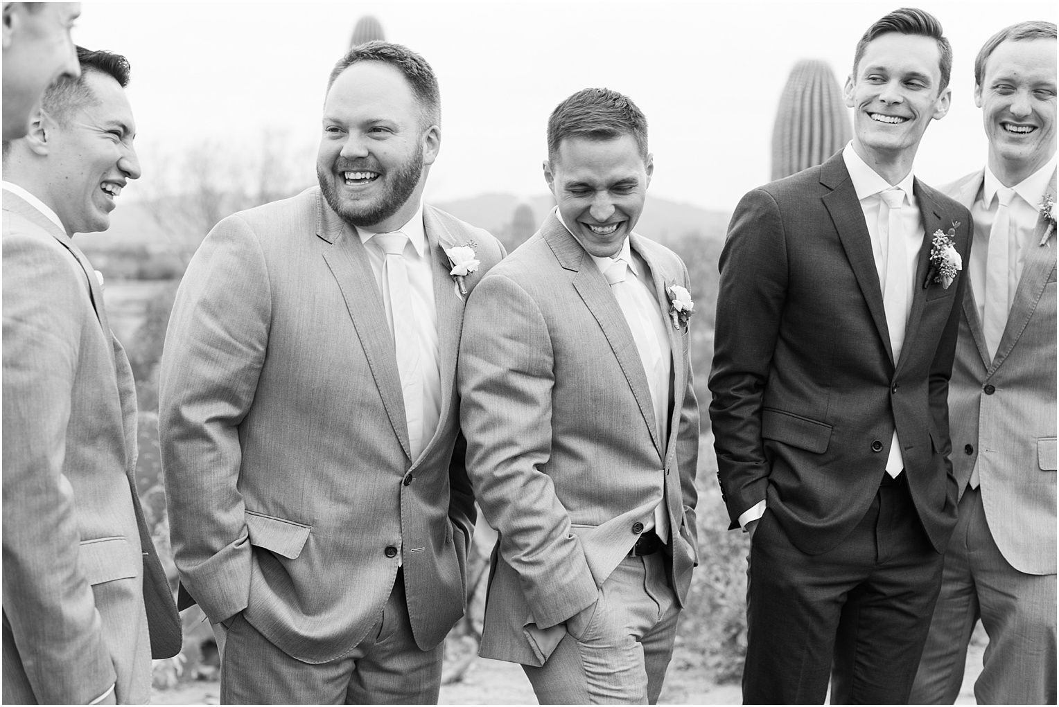 Highlands at Dove Mountain Wedding Grace + Danny groomsmen in grey and charcoal tuxes