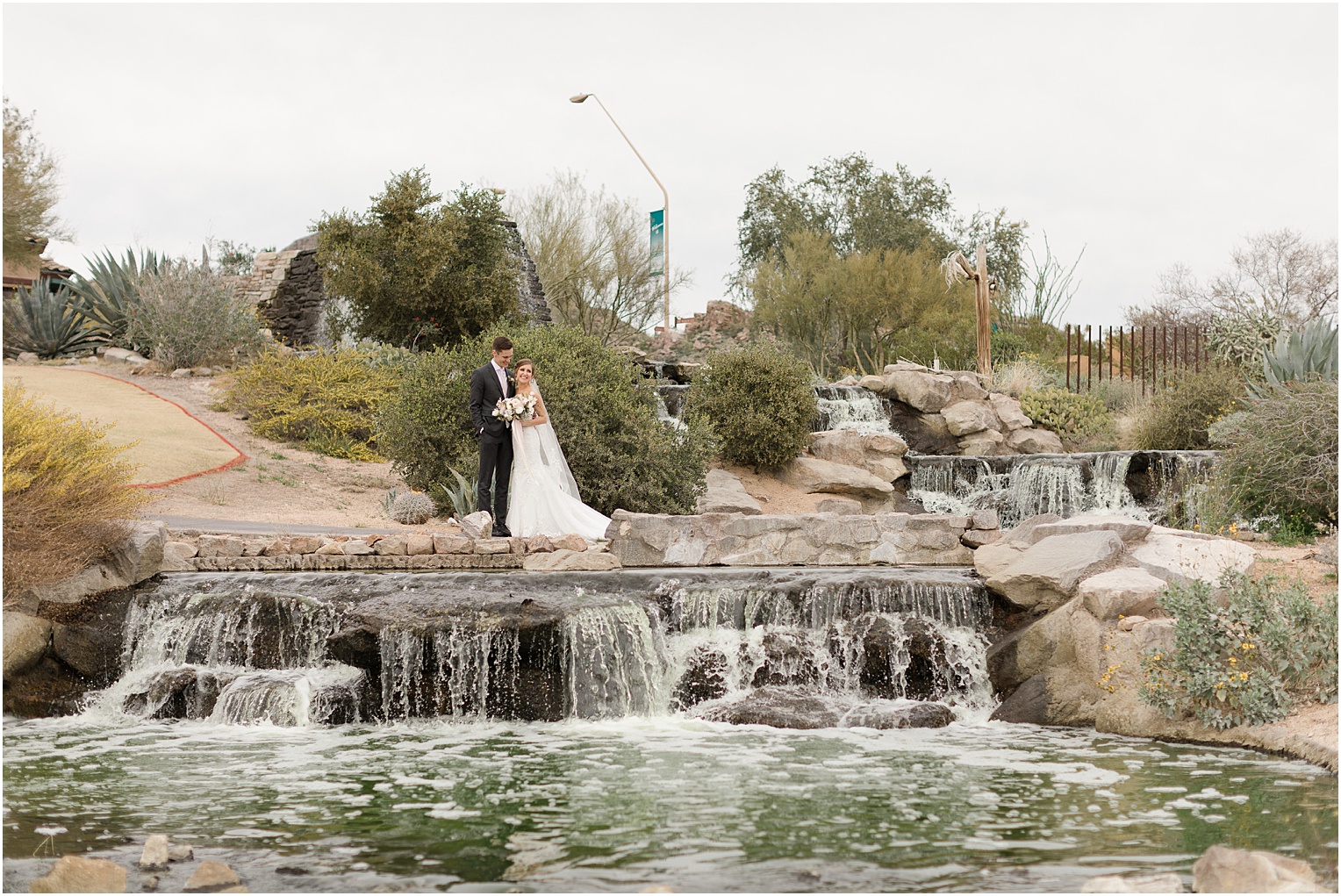Highlands at Dove Mountain Wedding Grace + Danny romantic bride and groom photos by small waterfall