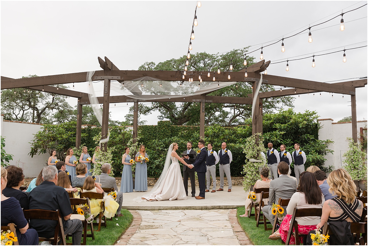 Garden Grove Wedding Venue in Austin, Texas Sarah & Viktor light blue and sunflower wedding outdoor ceremony