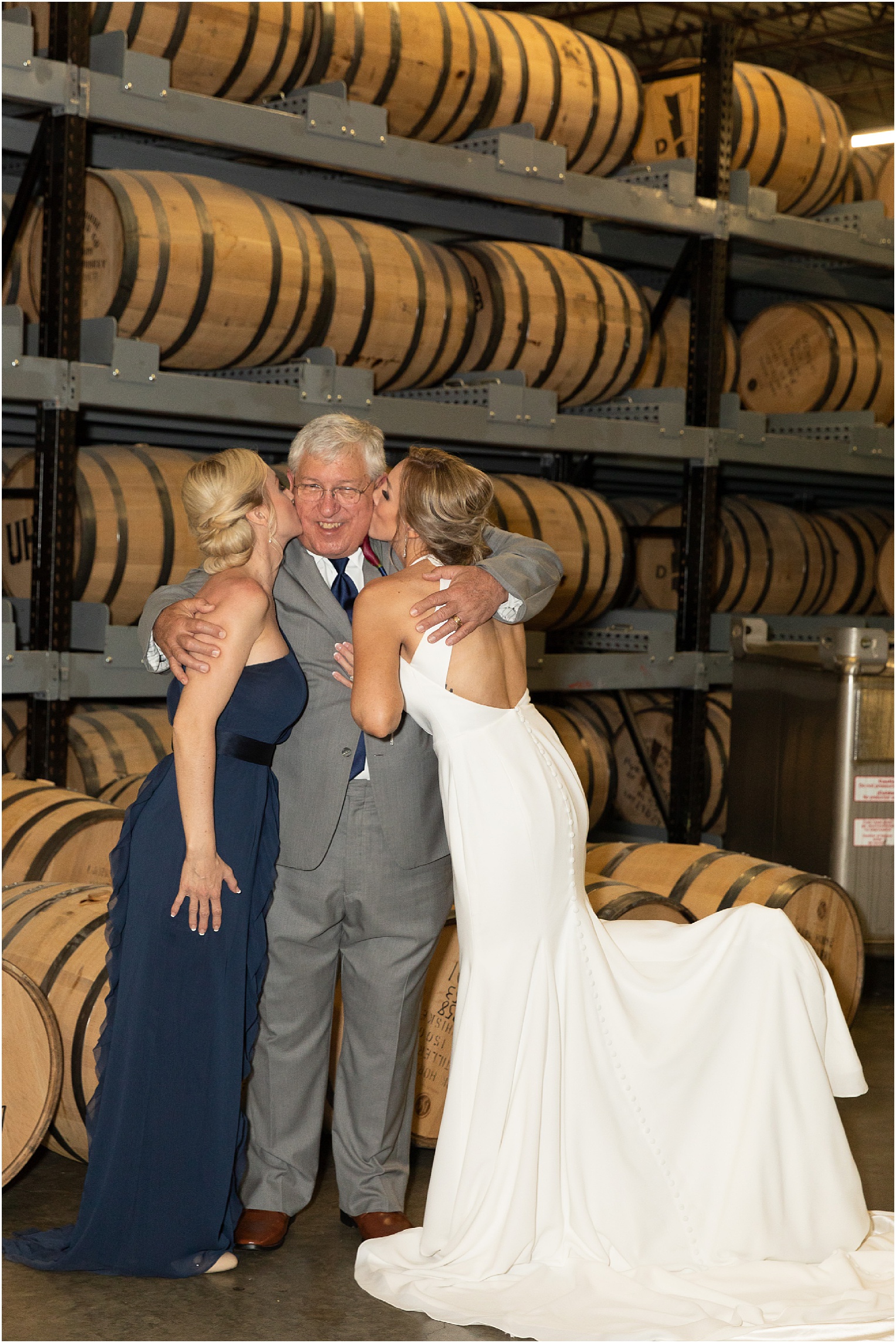 Kansas City Wedding at Union Horse Distilling Co. Danielle + Brandon Neutral White and Navy Spring wedding bridal party distillery photos