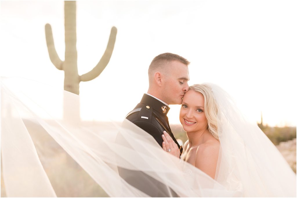 Tanque Verde Ranch Wedding Tucson, AZ Sloan + Garrett romantic sunset bride and groom photos and dramatic veil with cactus background