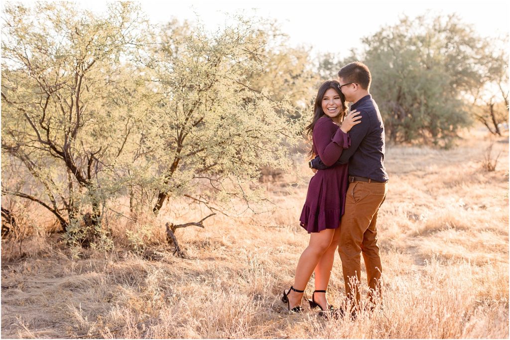 Engagement Photos at Catalina State Park Tucson, AZ Soley + David romantic sunset photos of bride and groom wearing eggplant and navy outfits at their engagement session in the desert