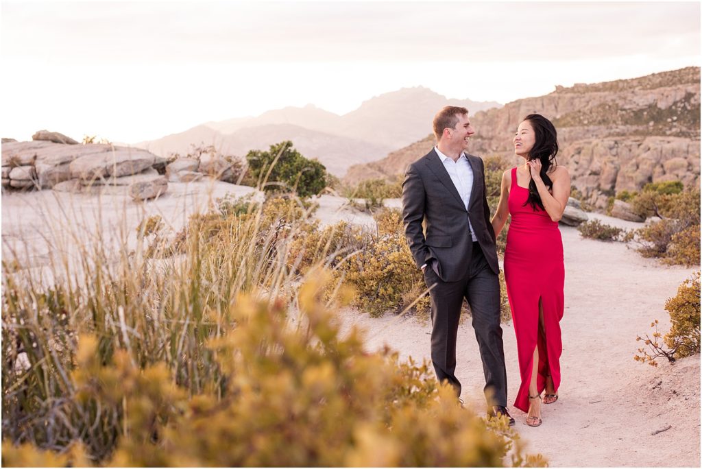 Sunset Photo Session on Mount Lemmon Tucson, AZ Katrina + Nick romantic engagement photo session with bride in a classic red dress and dramatic mountain views in background 