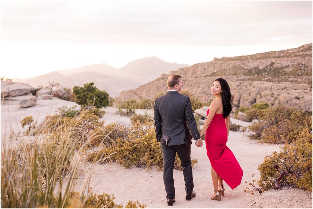 Sunset Photo Session on Mount Lemmon Tucson, AZ Katrina + Nick romantic engagement photo session with bride in a stunning red dress and dramatic mountain views in background 