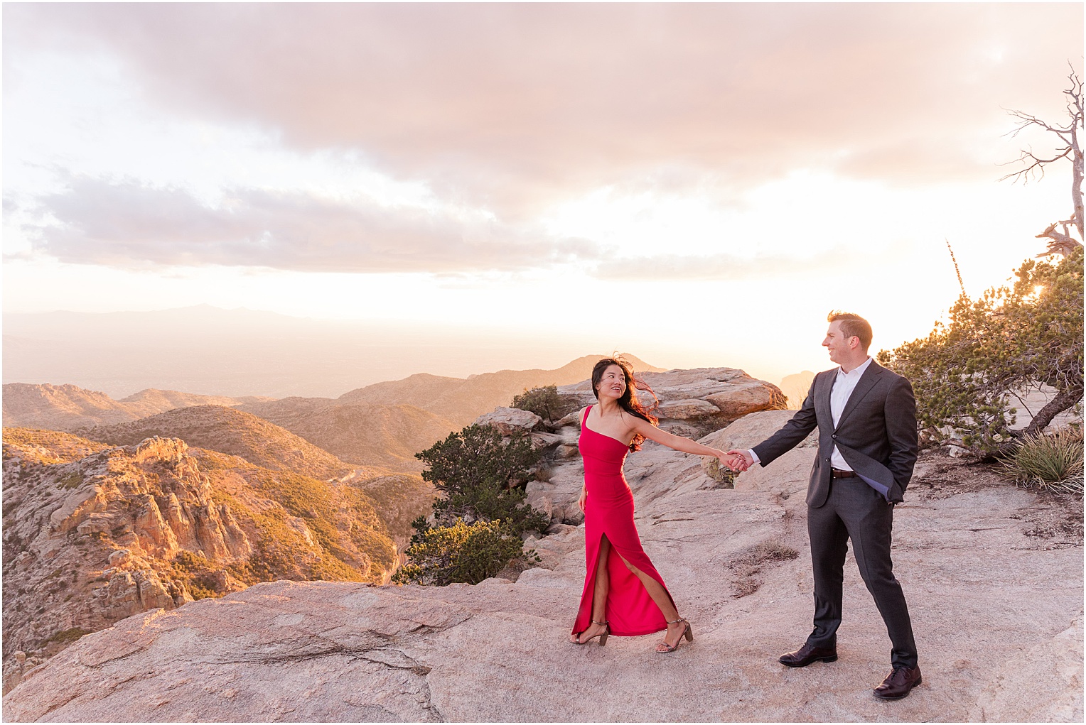 Sunset Photo Session on Mount Lemmon Tucson, AZ Katrina + Nick romantic engagement photo session with bride in a classic red dress and dramatic mountain views in background